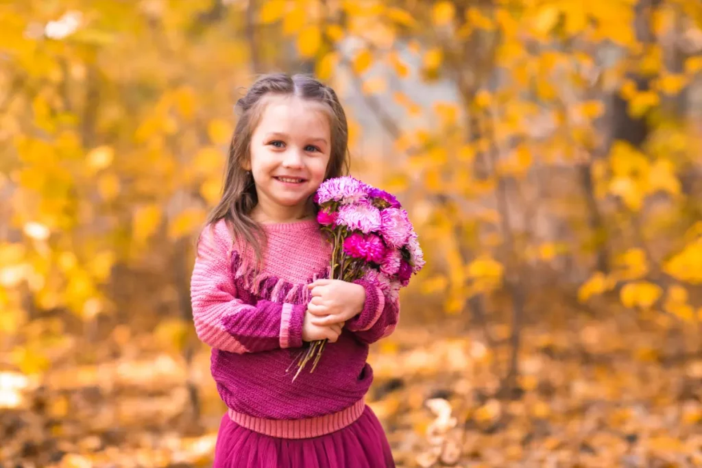 girl carrying flowers