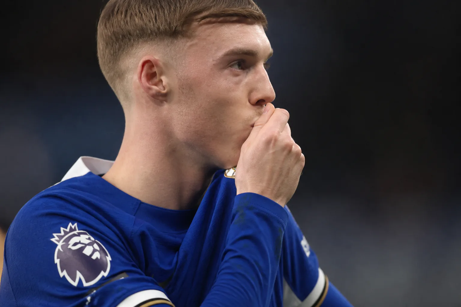 Soccer player kissing his hand